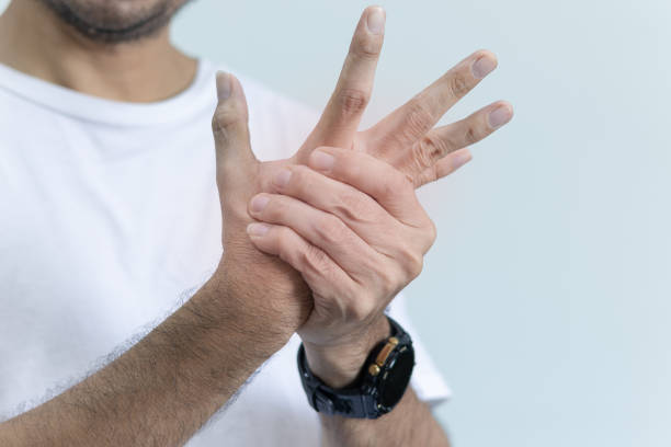 istock man with wrist injury 1439990502