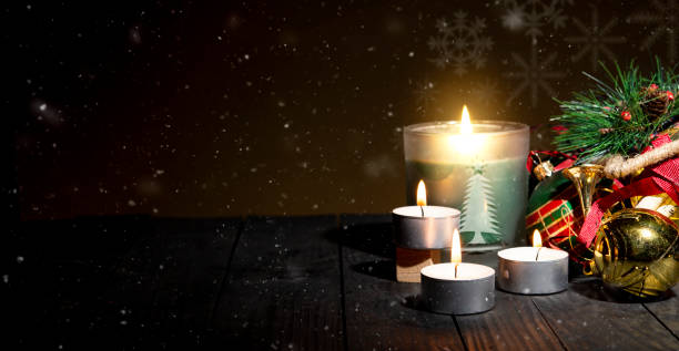 istock Snow theme Christmas banner with candles and celebration ornaments 1439998333