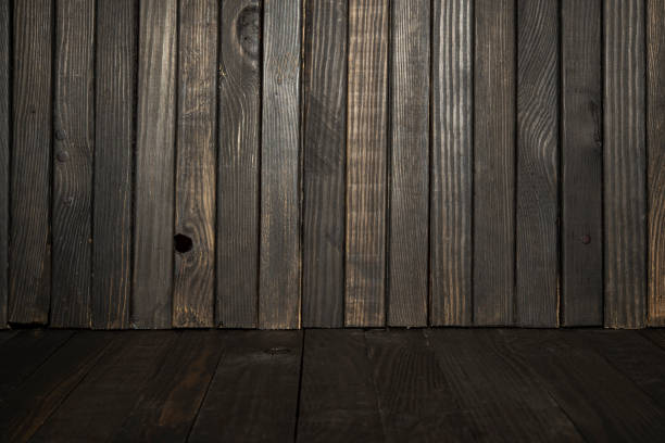 istock Natural dark wooden table pieces with texture background wallpaper and text space 1439998409