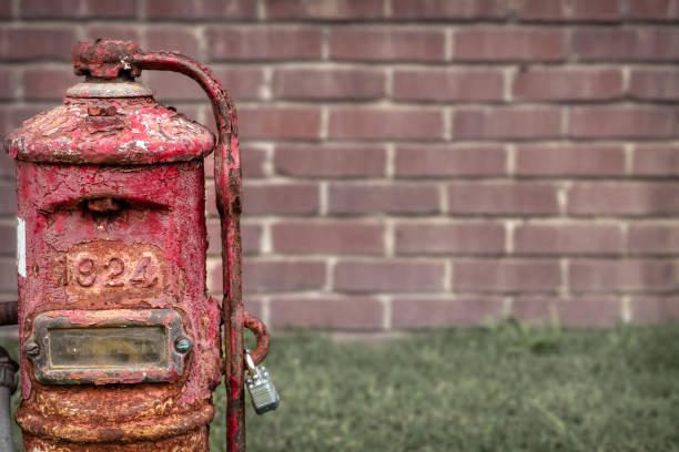 istock Antique painted and cracked pump in that has 1924 embossed on it. 1439999642