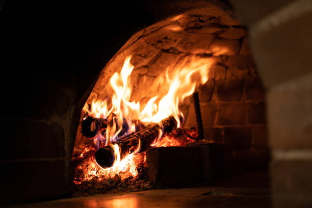 istock Flame on firewood in the fireplace. 1440000942