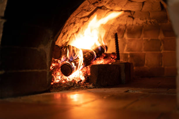 istock Flame on firewood in the fireplace. 1440000950
