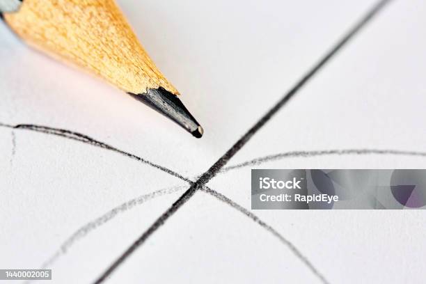 Extreme Closeup Of A Wooden Pencil With Geometric Curves And Lines Drawn On Paper Stock Photo - Download Image Now