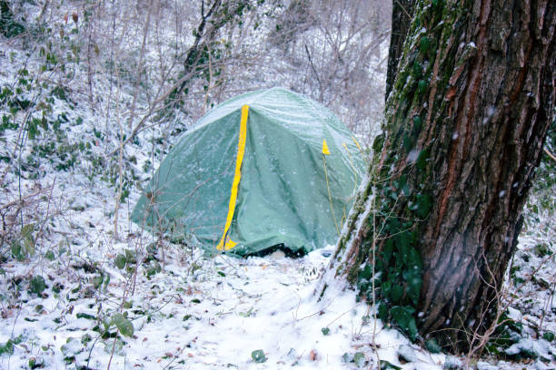 istock Tent is covered with snow, overnight hikers in forest 1440002289