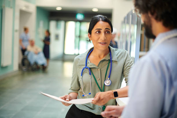 istock hospital doctor chatting to colleague 1440002425
