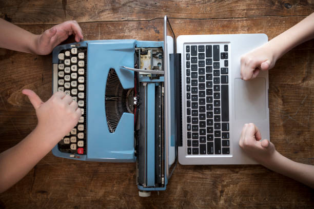 istock Laptop and typewriter with thumbs up 1440002478