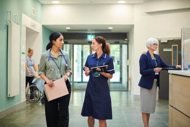 istock staff nurse consulting ward doctor 1440002490