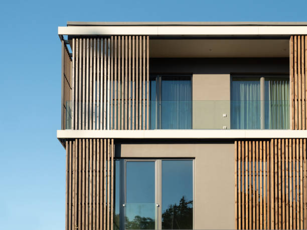 istock New modern residential building with balcony against blue sky. 1440004561