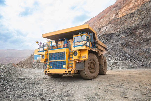istock Large yellow open-pit dump truck in an open-pit mining operation. 1440005211