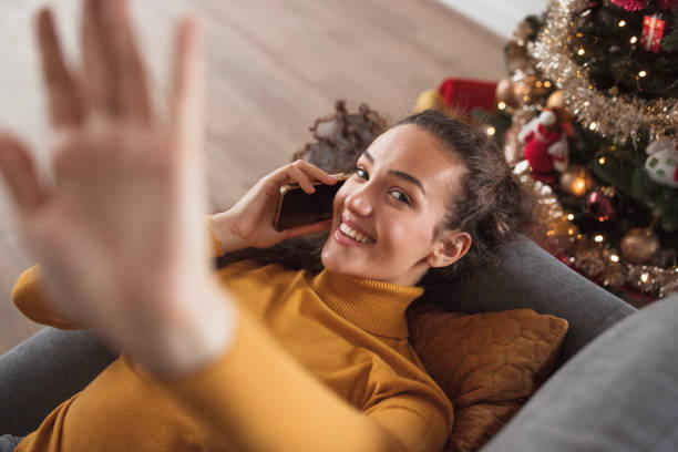 istock Girl lying on bed and having phone conversation 1440005533