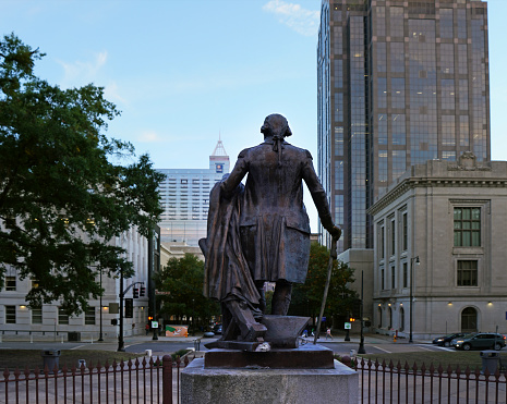 Wilmington, Delaware, USA: Rodney Square - statue of Caesar Rodney, a signer of the Declaration of Independence and President of Delaware, on his trusty steed, 1922 work by James Edward Kelly - DuPont building in the background - photo by M.Torres