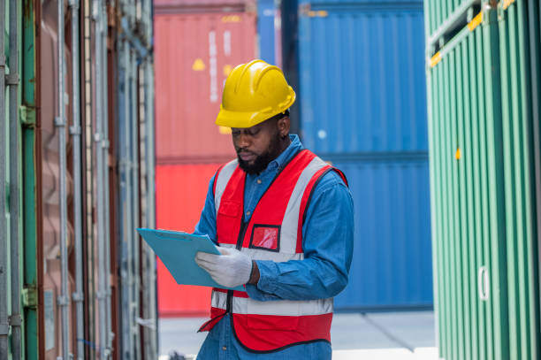 istock African American worker concept, African American worker working in warehouse containers for logistic import export, Black man worker 1440006804
