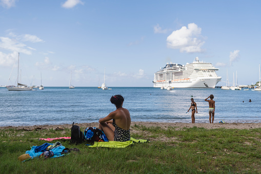Fort-de-France, Martinique - October 8, 2022: A mother and children sailing on the MSC Meraviglia enjoy a morning at La Française Beach during a port stop in Fort-de-France, Martinique.