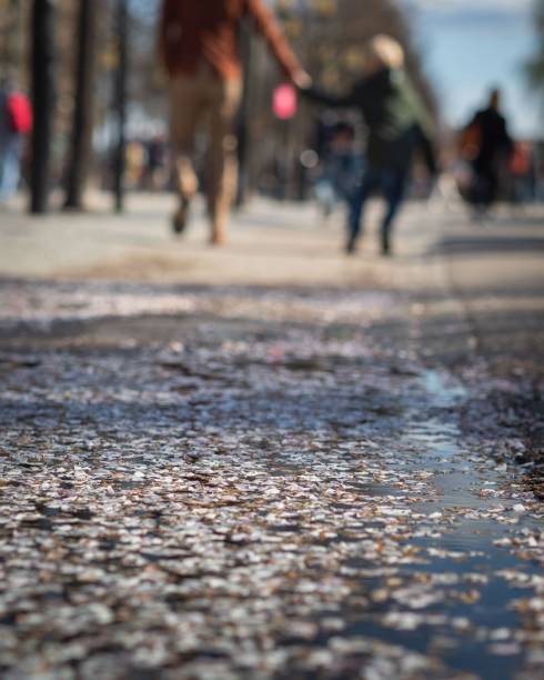 istock Selective focus of the road with people on the blurry background. 1440010958
