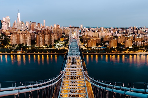 An aerial shot of the Queensboro Bridge and the buildings in New York City, United States