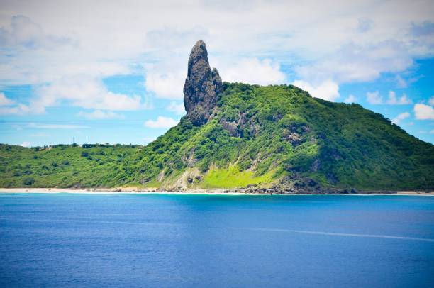 istock Exotic mountain formation in Brazil under a blue sky during daytime surrounded by water 1440011599
