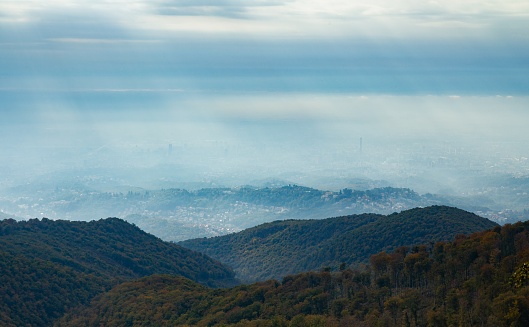 A high angle shot of mountain Medvednica in Zagreb Croatia on a foggy autumn weather