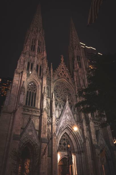 istock Low-angle vertical shot of the Cologne Cathedral in Germany at night 1440012221