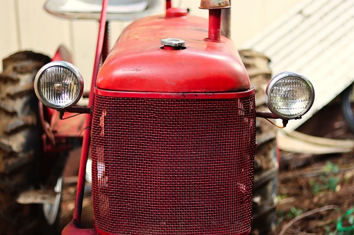 A closeup shot of the red vintage tractor