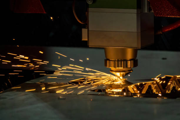 The fiber laser cutting machine cutting machine cut the metal plate. The fiber laser cutting machine cutting machine cut the metal plate. The hi-technology sheet metal manufacturing process by laser cutting machine. laser cutting metal stock pictures, royalty-free photos & images
