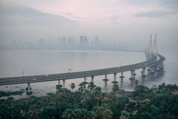 Photo of High angle shot of Bandra Worli sealink in Mumbai enveloped with fog