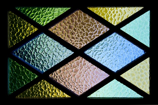 A background image of a colorful stained glass with beautiful textures