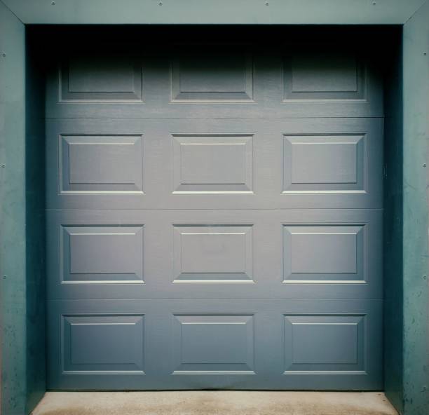 istock Grey sectional garage door with panels on grey frame 1440013334