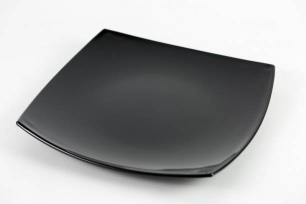 istock High angle shot of a black ceramic plate isolated on a black background 1440013661