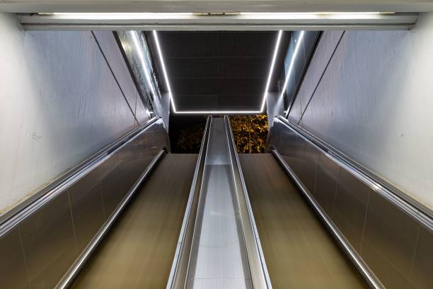 istock Interior view of a building with escalators in motion at night 1440013822