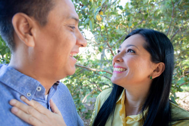 istock Couple in the park 1440014983