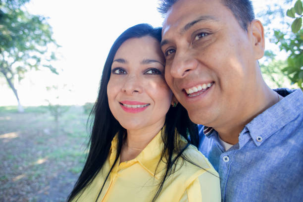 istock Couple in the park 1440015147