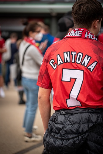 Manchester, United Kingdom – September 11, 2021: Manchester united fan with Cantona t shirt number