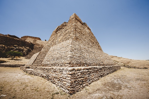 A beautiful shot of the La Quemada Zacatecas pyramid with a blue sky in the background