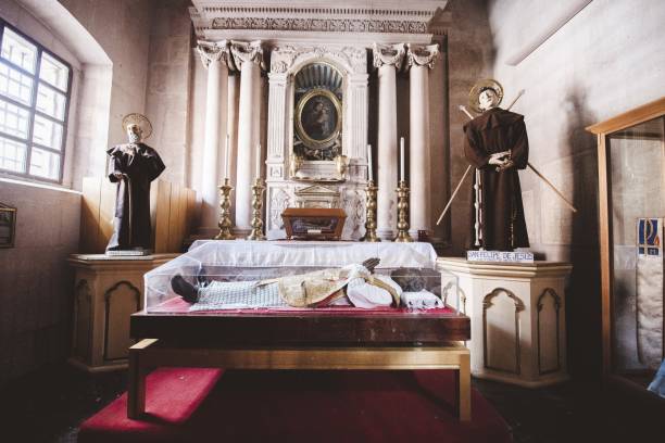 istock Dead priest surrounded by statues in a Catholic Church in Mexico 1440015862