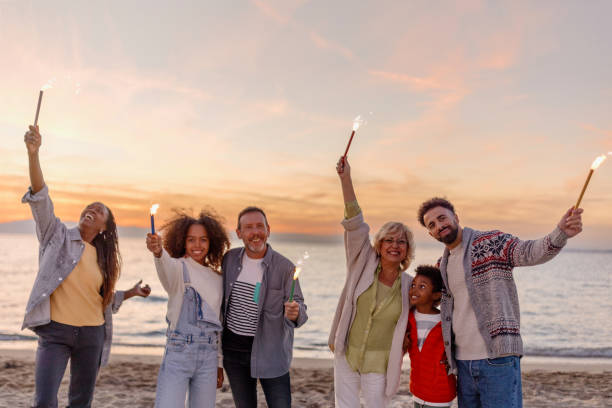 istock Multi-generation family celebrating Christmas on the beach 1440017027