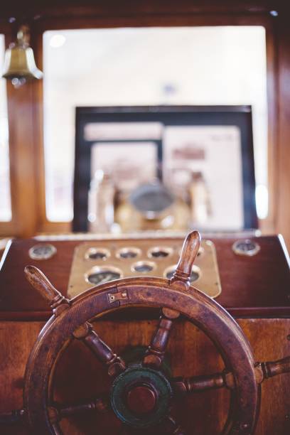 istock Vertical closure shot of a boat steering wheel with a blurred background 1440017422