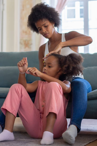 istock Mother and daughter getting ready to go for walk 1440017532