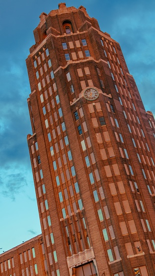 A vertical low angle shot of Buffalo Central Terminal under the beautiful cloudy sky