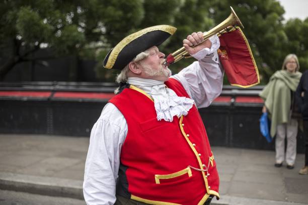 Town Crier London, United Kingdom – May 30, 2016: Town Crier announces the news of events in Camden Market town criers stock pictures, royalty-free photos & images
