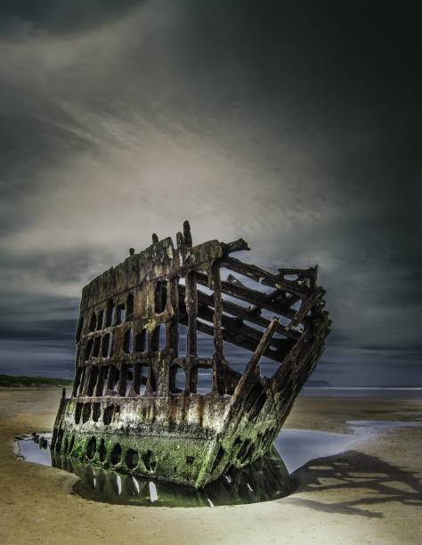 istock Wreck of the Peter Iredale reflected in a water surface under the breathtaking clouds 1440019585