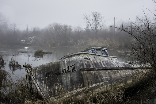 Foggy day Shot of Decaying Fishing Boats lying in rest in Finn Slough, near Richmond, BC