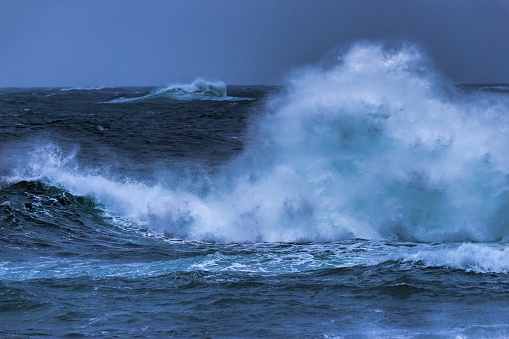 Powerful sea waves on a rocky beach