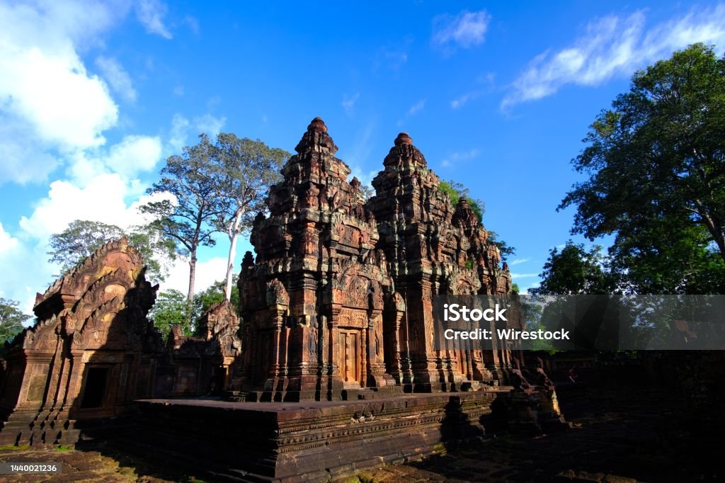 Beautiful low angle shot of the Banteay Srei temple in Cambodia under the bright sky A beautiful low angle shot of the Banteay Srei temple in Cambodia under the bright sky Ancient Stock Photo