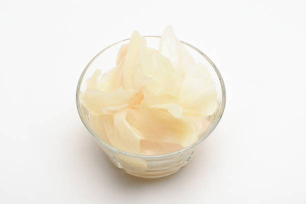 Homemade sauerkraut in a glass bowl on the white background