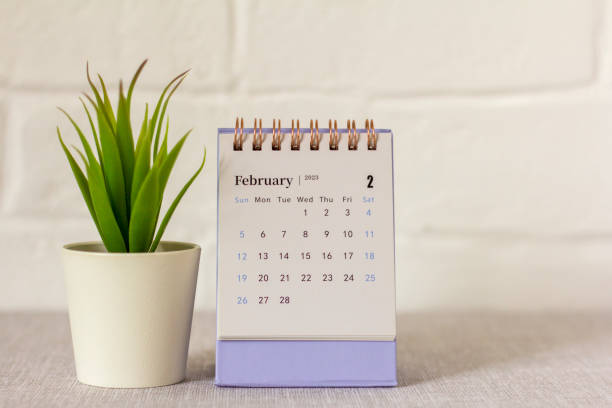 istock Desktop calendar for February 2023 on a light background., 1440022244