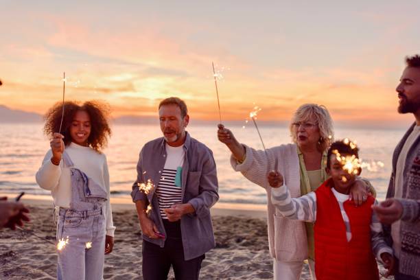 istock Multi-generation family celebrating Christmas on the beach 1440023003