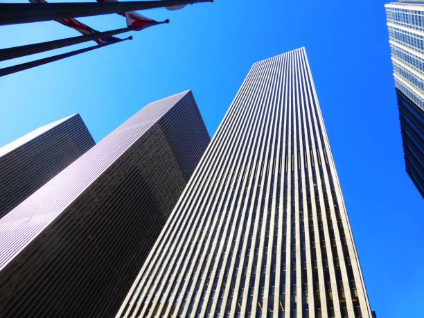 istock Low angle shot of high rise skyscrapers under a clear blue sky 1440023087