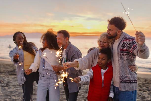 istock Multi-generation family celebrating Christmas on the beach 1440023174
