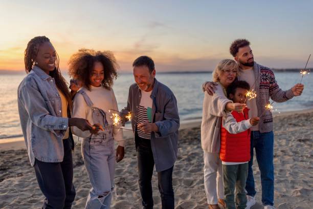 istock Multi-generation family celebrating Christmas on the beach 1440023844