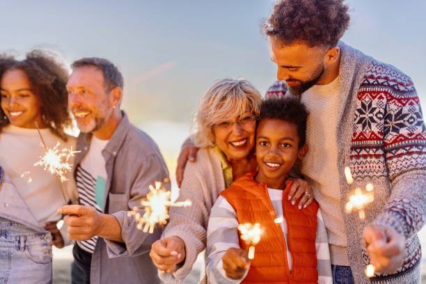 istock Multi-generation family celebrating Christmas on the beach 1440023869